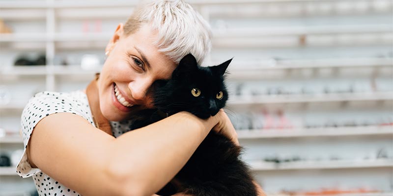 A woman holding her cat