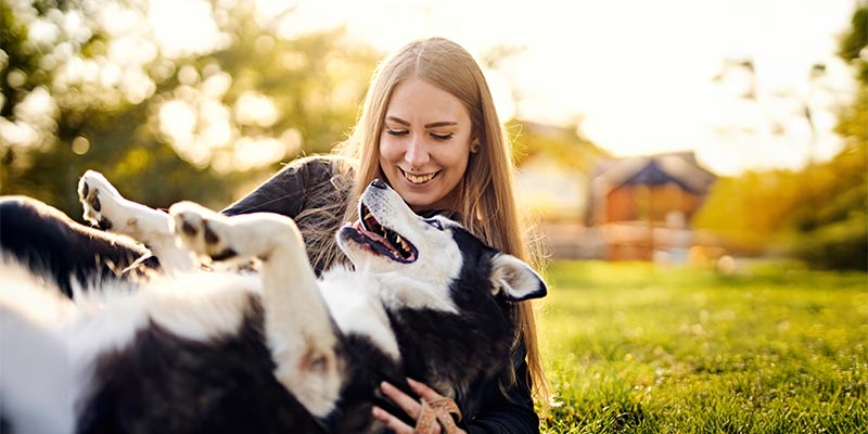 A woman hugging her dog